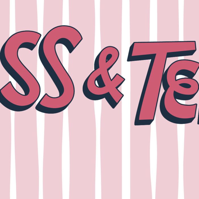 Text reads "Kiss & Tell!" in bold pink and black letters on a pink and white striped background. Heart shapes and a kiss print accent the playful tone.