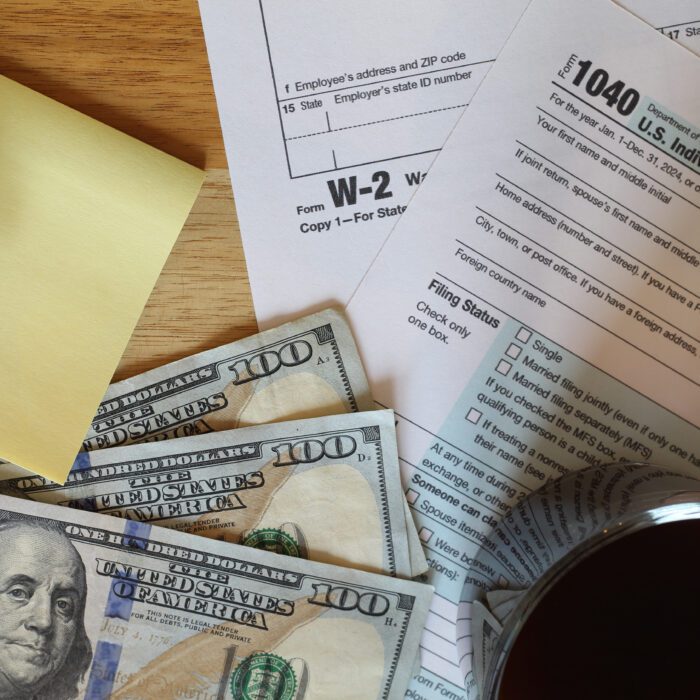 IRS 1040 and W-2 tax forms, close up, top down view