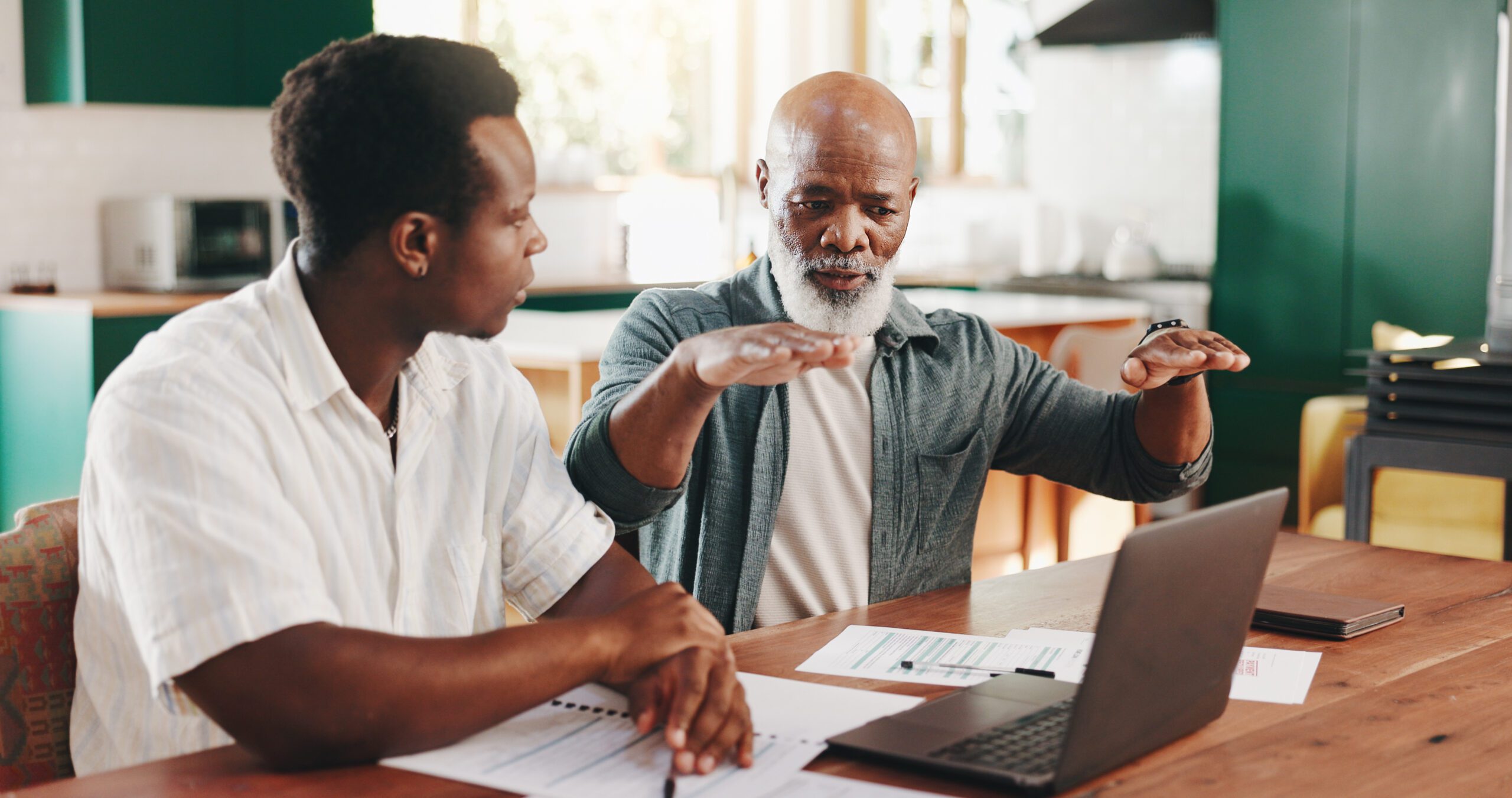 Father, son and help with finance on laptop for advice or mortgage application in senior home. Budget, men and discussion for bank loan, savings and teaching investment planning with African family.