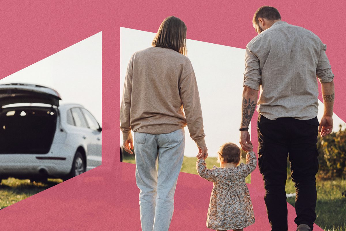 Family of three walking away, holding hands, with car trunk open in background