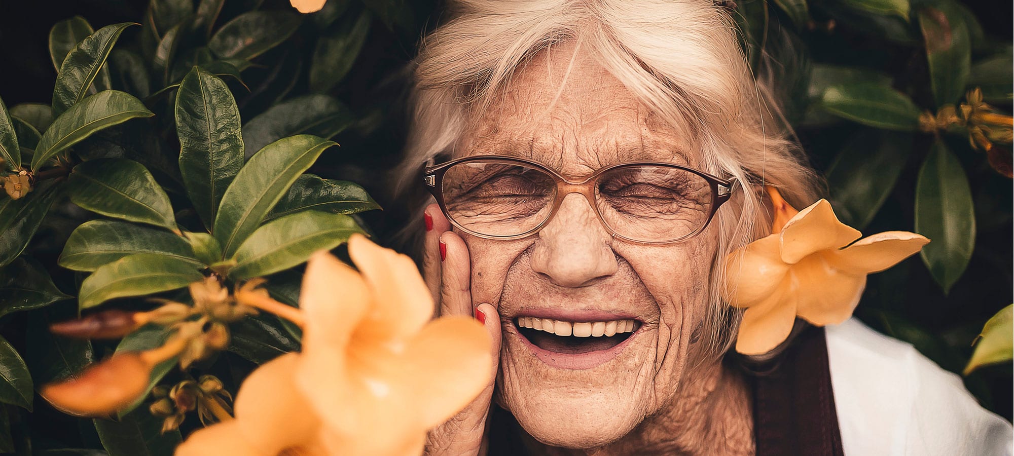 Older lady smiling in garden