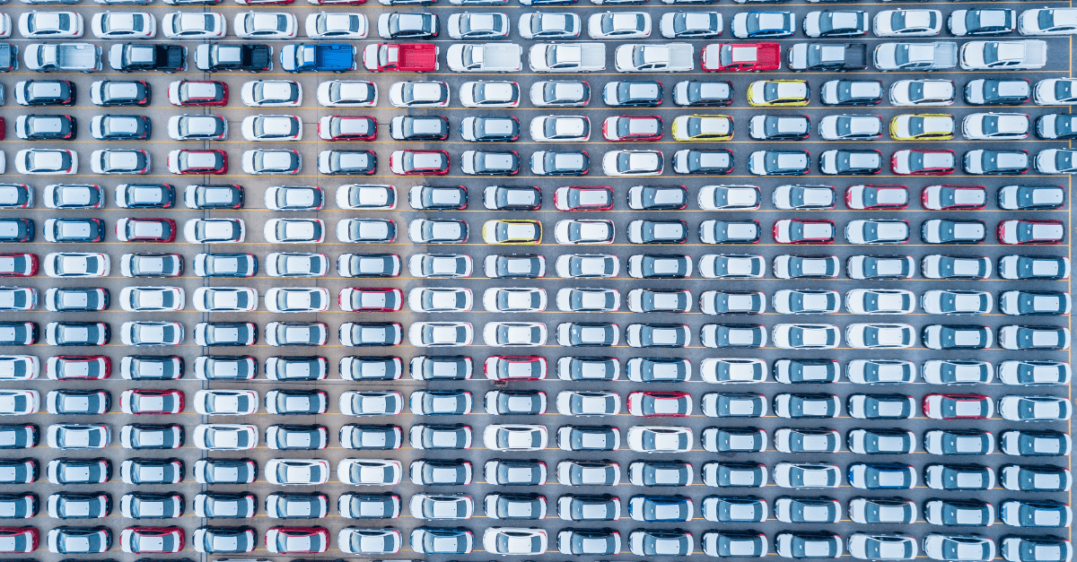 car lot from above various colors of cars