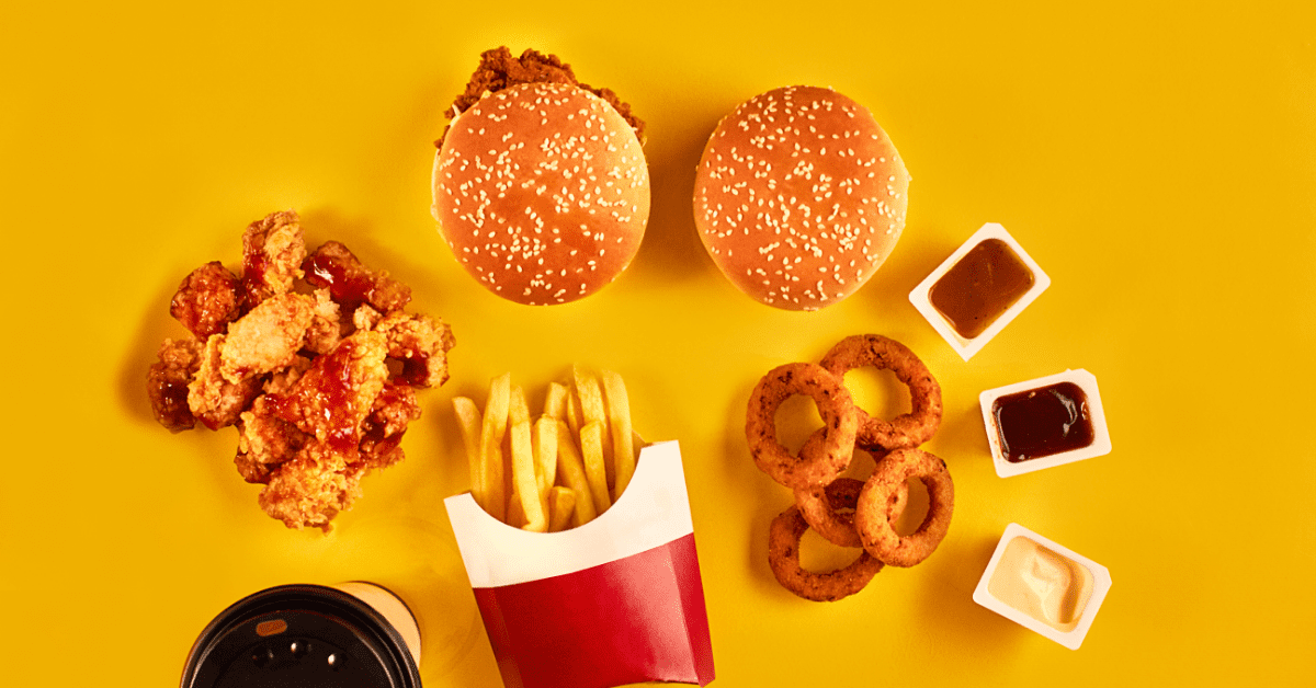 yellow back ground burger fries chicken nuggets onion rings coffee sauces
